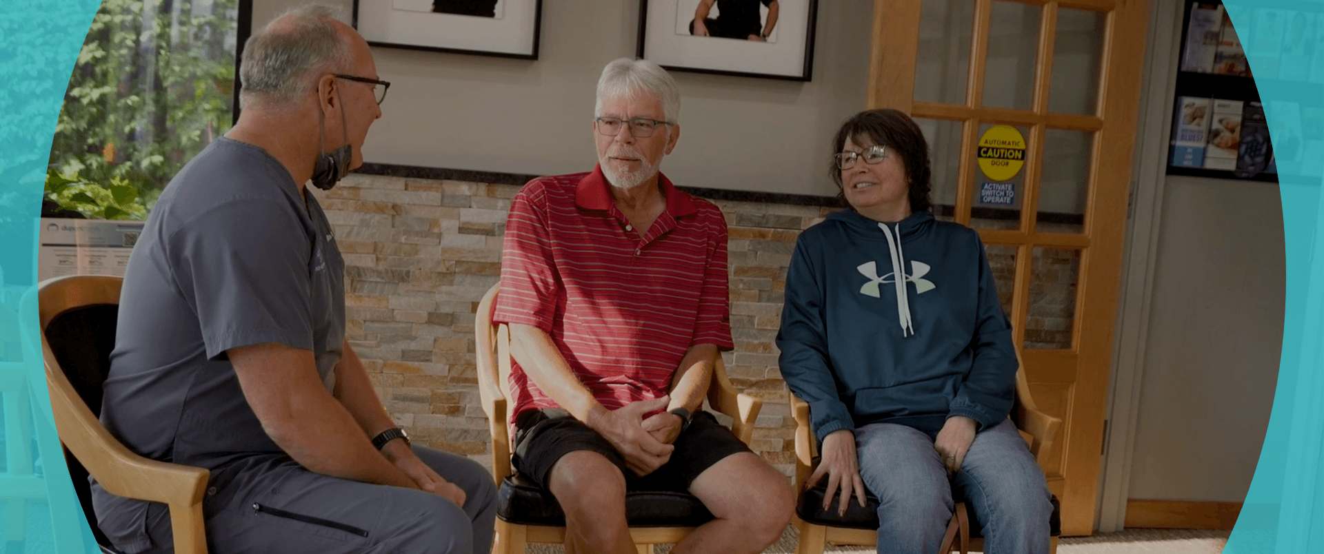 Dupont Family Dentistry patients smiling while speaking with Dr. Diehl in lobby.